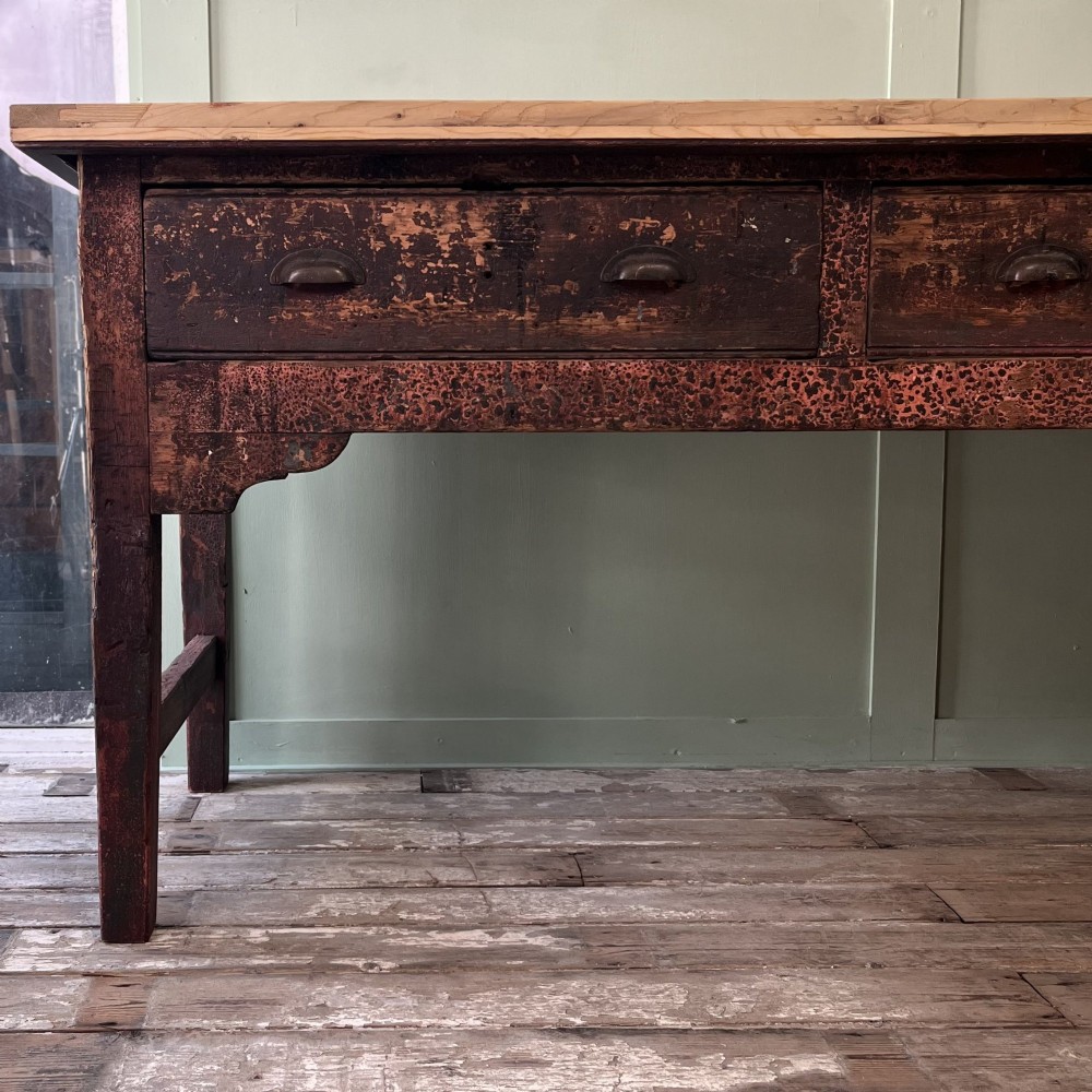 An early 19th-century pine serving table featuring a natural scrubbed timber top and a dark painted base with six legs and four drawers. View III