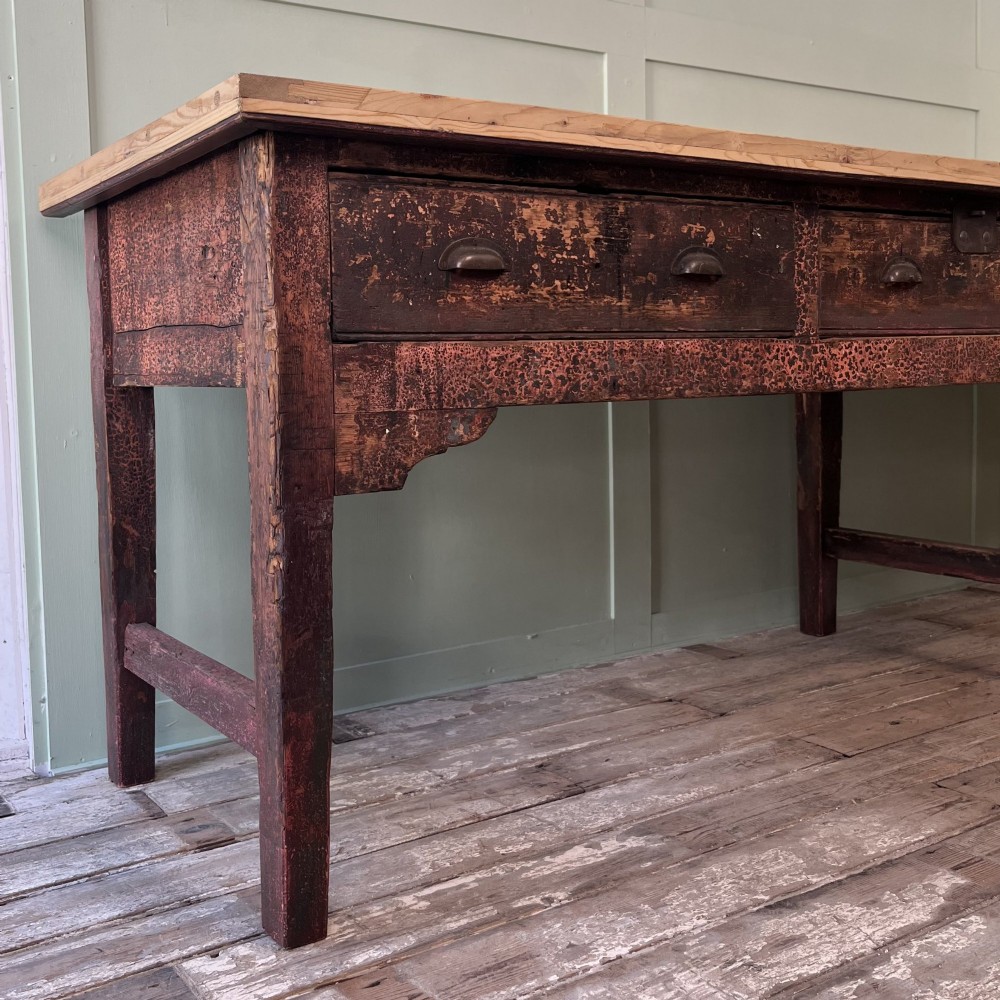 An early 19th-century pine serving table featuring a natural scrubbed timber top and a dark painted base with six legs and four drawers. View XIII