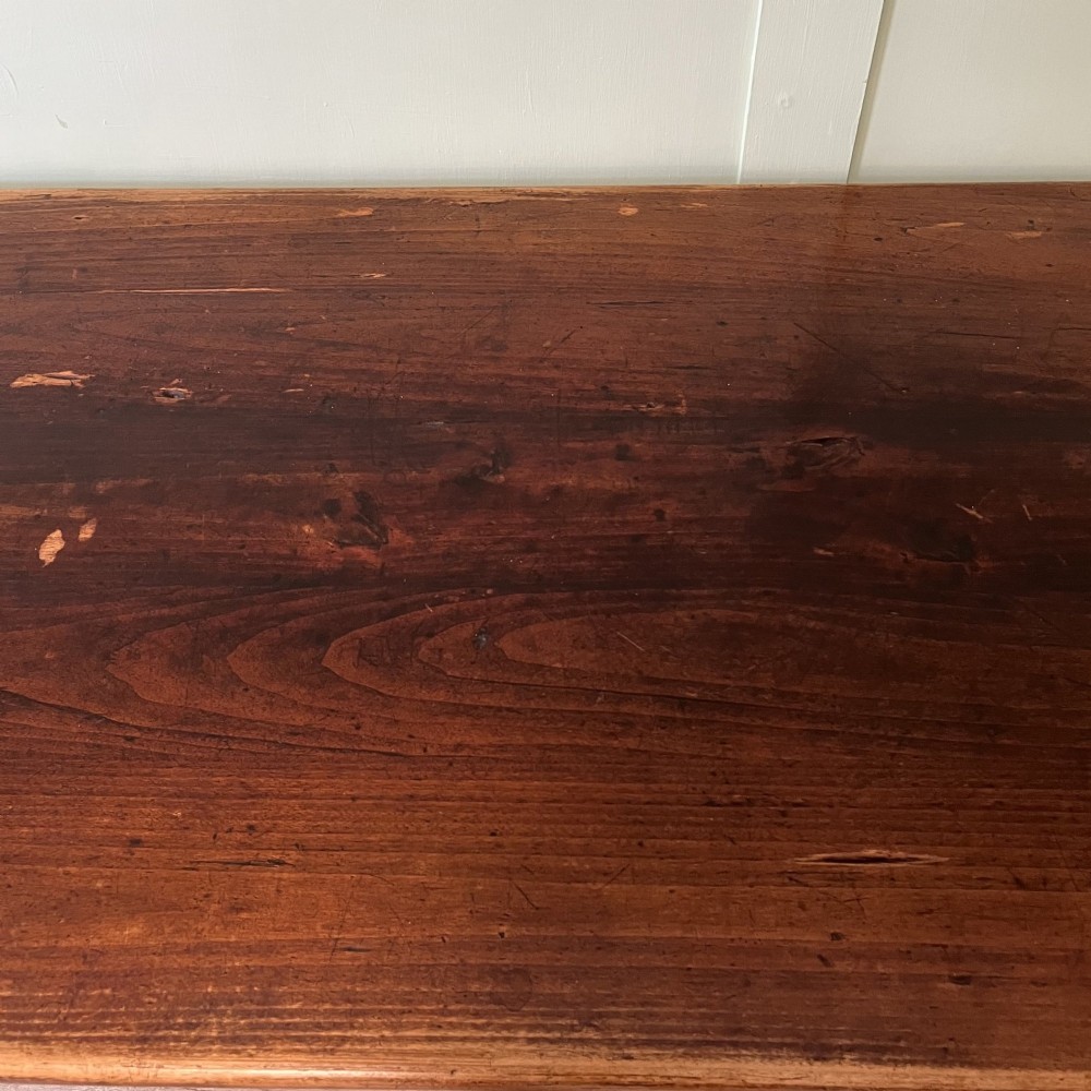 A nineteenth-century French cherrywood farmhouse dining table featuring tapered square legs and a rectangular plank top. View XII
