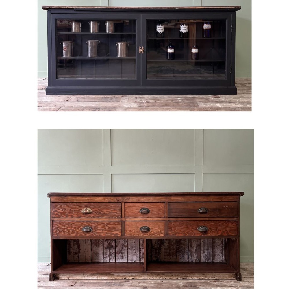 A Victorian shop counter featuring a dark painted pine base with two large glass panel doors and a polished mahogany top surface. View XIII