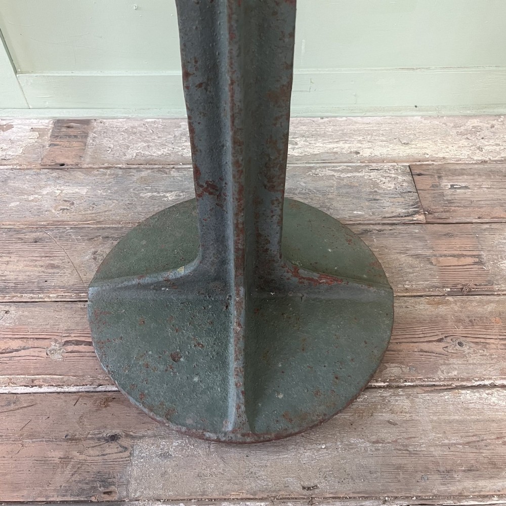 A cast iron George VI post box with a raised GR Royal cypher alongside a tall matching metal pedestal stand. View V