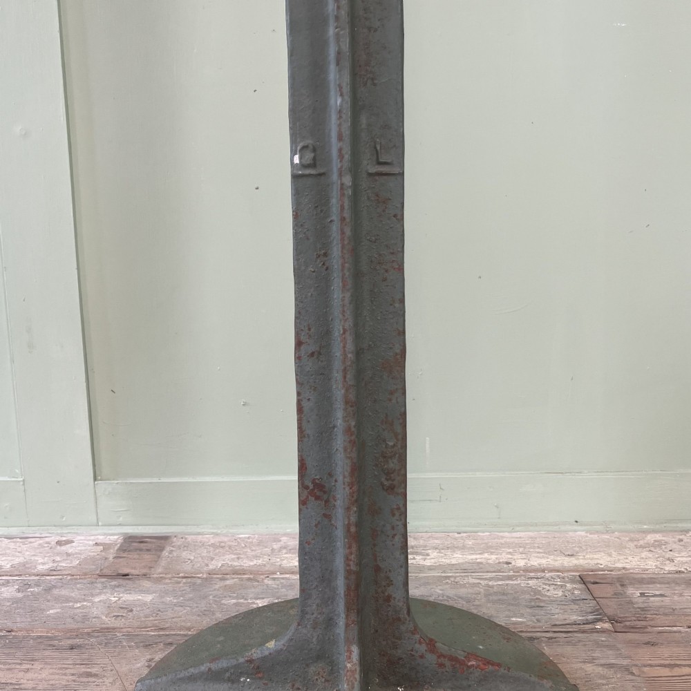 A cast iron George VI post box with a raised GR Royal cypher alongside a tall matching metal pedestal stand. View VII