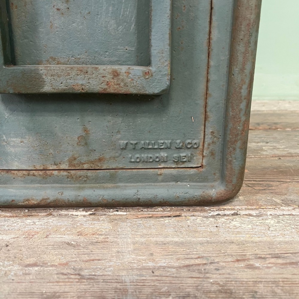 A cast iron George VI post box with a raised GR Royal cypher alongside a tall matching metal pedestal stand. View VIII