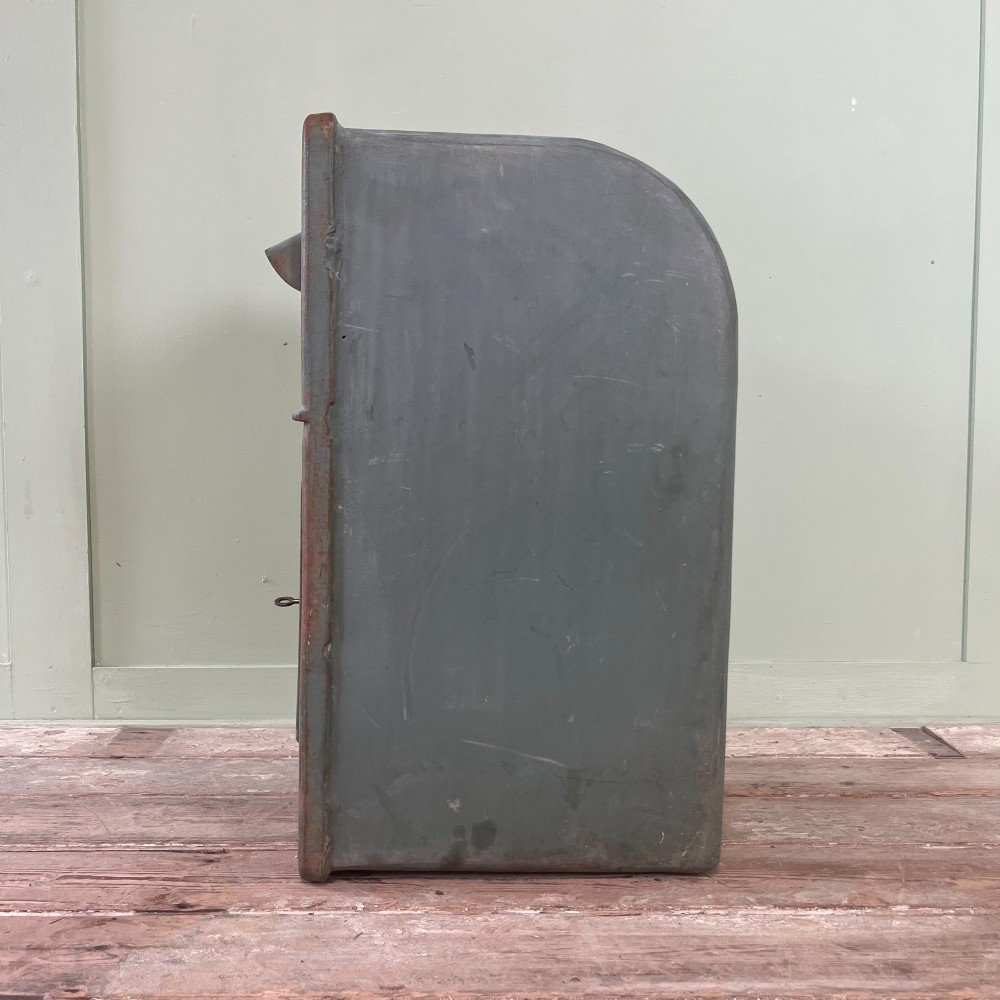 A cast iron George VI post box with a raised GR Royal cypher alongside a tall matching metal pedestal stand. View XI