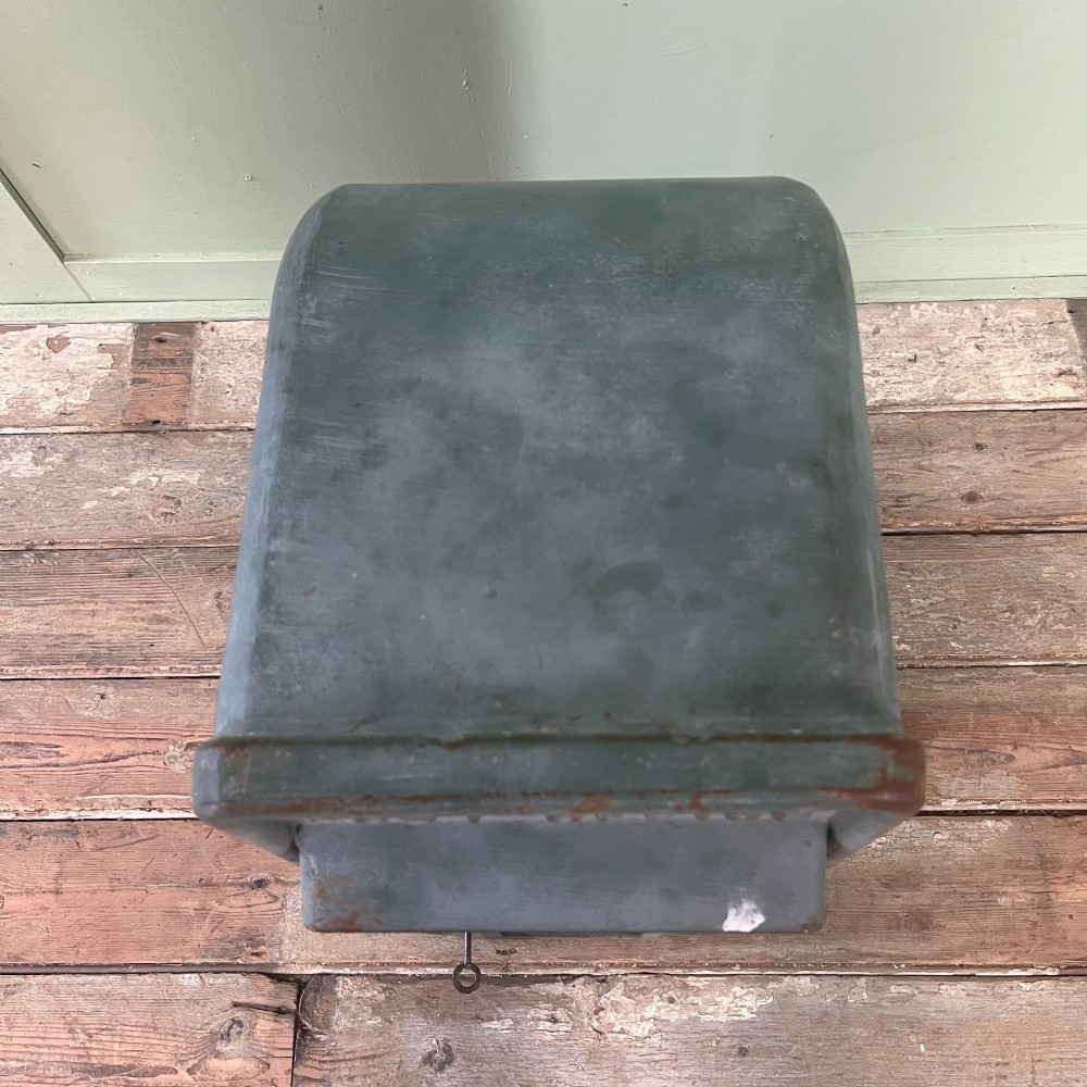A cast iron George VI post box with a raised GR Royal cypher alongside a tall matching metal pedestal stand. View XV