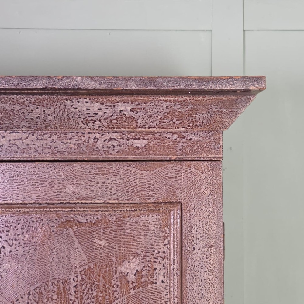 A tall late Georgian painted pine housekeepers cupboard featuring panelled upper doors and three lower drawers on turned feet. View VIII
