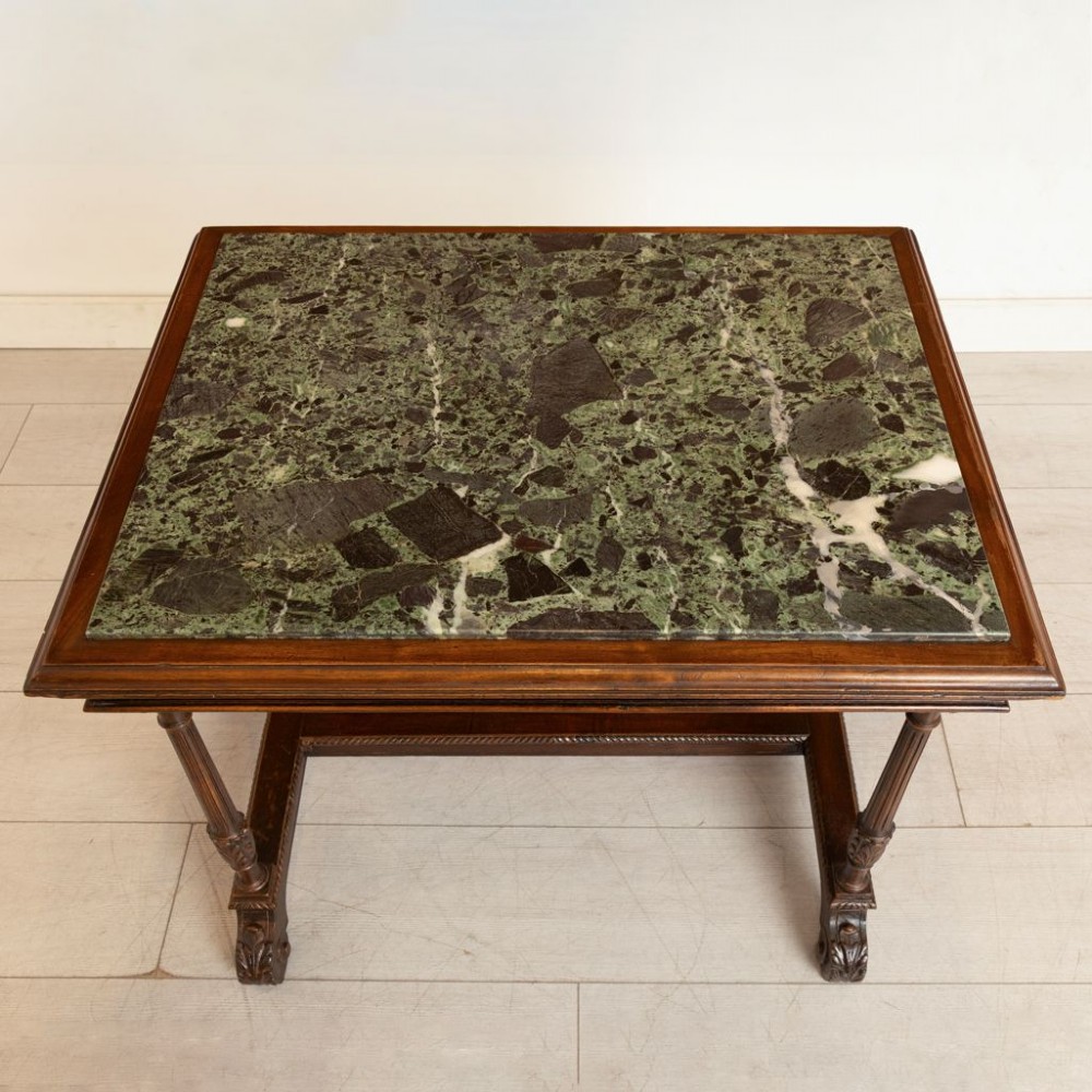 A 19th-century rectangular mahogany side table featuring a carved fluted apron, turned legs with an H-stretcher, and an inset green marble top. View III