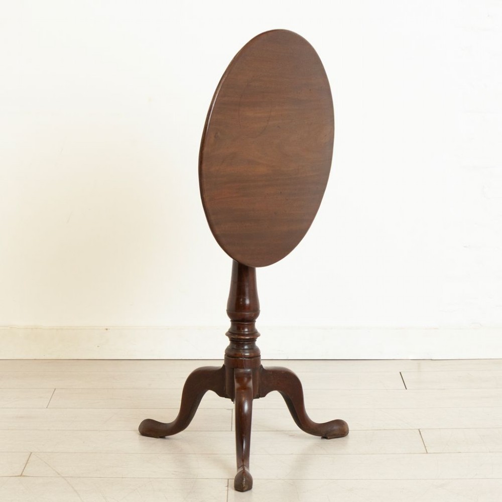An 18th-century Georgian mahogany side table featuring a circular tilt top, a square birdcage mechanism, a turned central stem, and three cabriole tripod legs with pad feet. View II