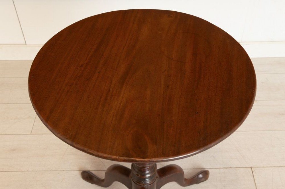 An 18th-century Georgian mahogany side table featuring a circular tilt top, a square birdcage mechanism, a turned central stem, and three cabriole tripod legs with pad feet. View III