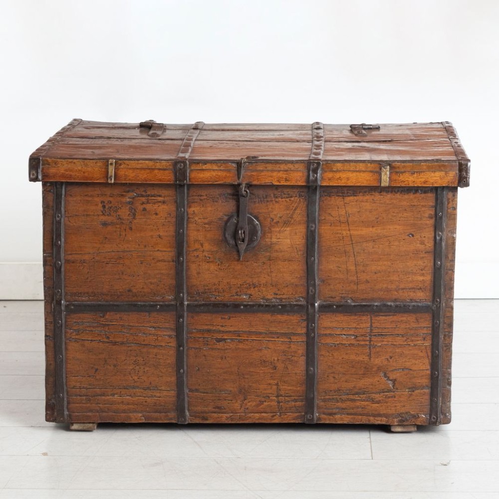 A mid-nineteenth-century dark mahogany rectangular chest featuring outer iron binding straps, iron side drop handles, and an iron front latch. View II
