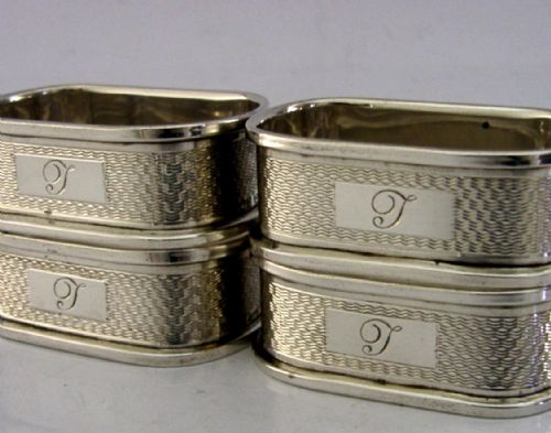 FOUR ENGLISH SOLID STERLING SILVER ENGINE TURNED NAPKIN RINGS 195960 - ADDITIONAL PHOTO 1