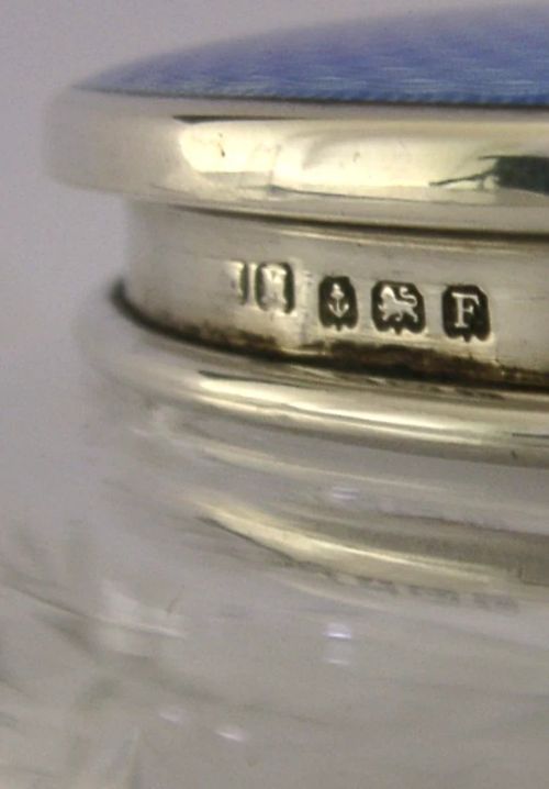 An Art Deco cut glass vanity jar featuring a sterling silver lid with royal blue engine-turned guilloche enamel. View VII