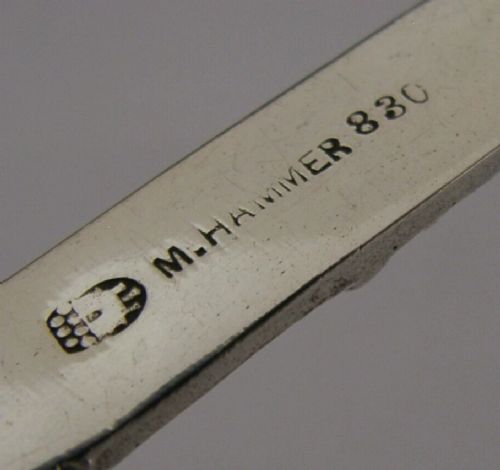 An antique Norwegian 830 silver baptism spoon featuring an engraved drop-shaped bowl and a detailed cast decorative handle. View VI