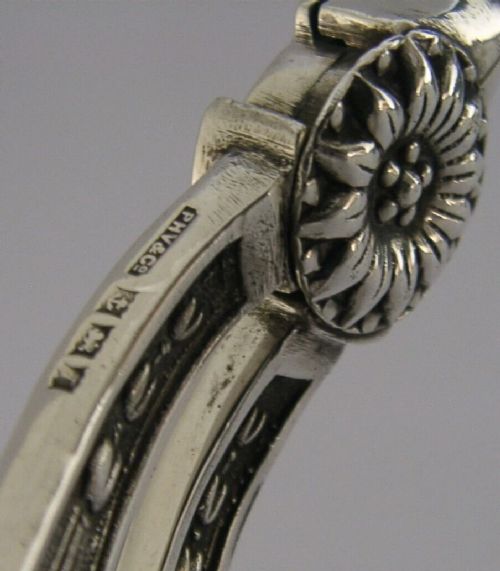 A pair of English sterling silver grape shears featuring Gothic relief carving on the handles and a central floral pivot. View XI