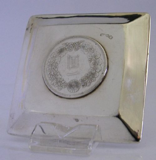 A square sterling silver coin dish featuring a central Japanese One Yen silver coin, hand-hammered interior border, and bamboo-style rim. View IV