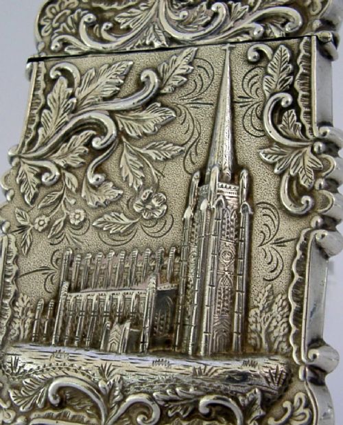 A mid-19th-century sterling silver card case featuring an embossed architectural depiction of Trinity Church surrounded by foliate scrollwork. View II