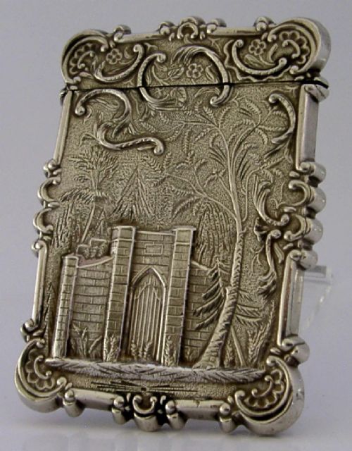 A mid-19th-century sterling silver card case featuring an embossed architectural depiction of Trinity Church surrounded by foliate scrollwork. View IV
