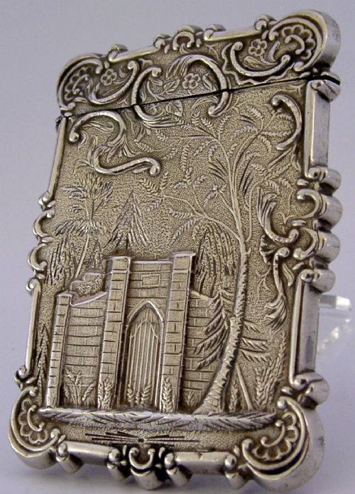A mid-19th-century sterling silver card case featuring an embossed architectural depiction of Trinity Church surrounded by foliate scrollwork. View V