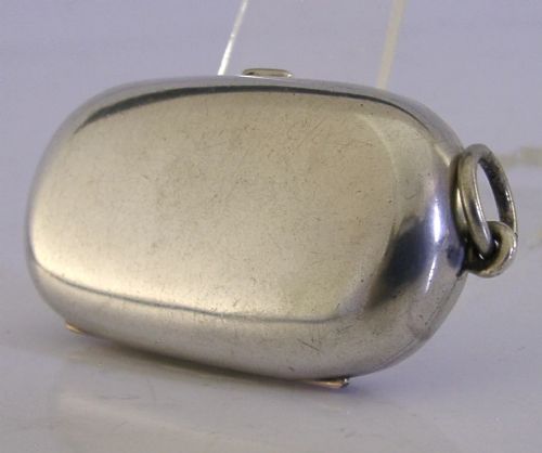 An open Edwardian sterling silver double sovereign case with gold hinge detail showing two spring-loaded coin compartments. View VI