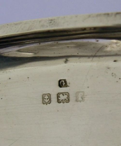 An open Edwardian sterling silver double sovereign case with gold hinge detail showing two spring-loaded coin compartments. View VIII