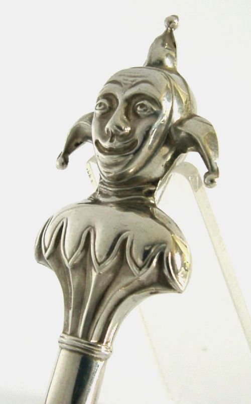 An Edwardian sterling silver sealing wax holder topped with a cast jester bust wearing a cap and bells. View III