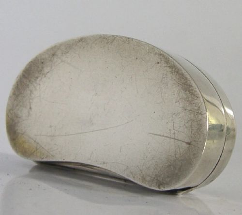 An Edwardian kidney-shaped sterling silver box featuring a white guilloche enamelled lid bordered with deep royal blue enamel. View IX