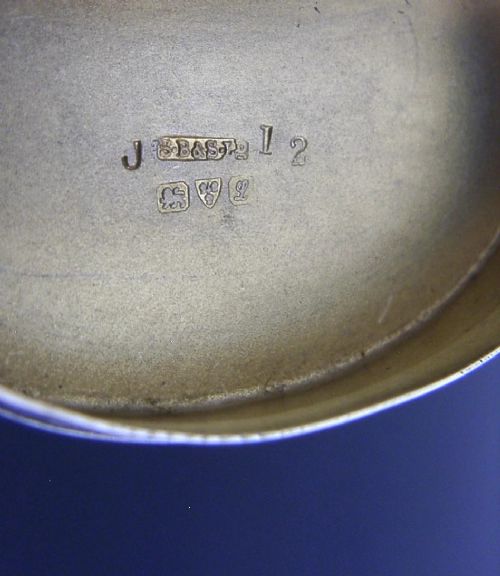 An Edwardian kidney-shaped sterling silver box featuring a white guilloche enamelled lid bordered with deep royal blue enamel. View XIII
