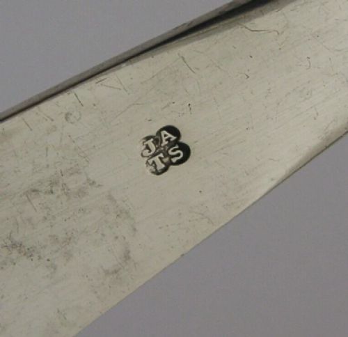 Victorian sterling silver serving tongs featuring slotted rectangular blades and a spring-hinged handle stamped with hallmarks. View VIII