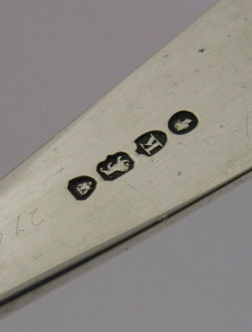 Victorian sterling silver serving tongs featuring slotted rectangular blades and a spring-hinged handle stamped with hallmarks. View IX
