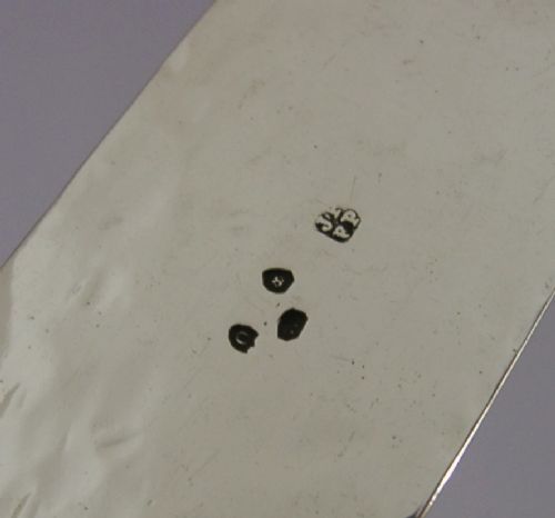 An engraved Victorian sterling silver page turner featuring script inscriptions along its flat blade. View VI