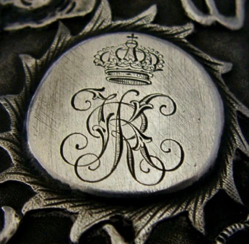 A cylindrical Chinese export silver beaker featuring high-relief repousse dragon motifs and an oval cartouche engraved with a royal monogram beneath a crown. View II