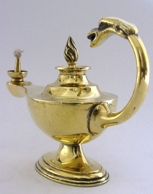 An antique Edwardian silver gilt cigar lighter crafted in the shape of a classical oil lamp with a serpent head handle and flame finial. View IV
