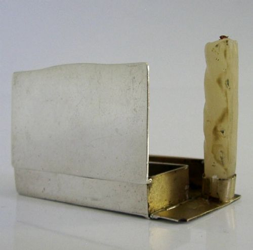 A Victorian sterling silver combination vesta case and go-to-bed taper holder with its hinged lid open. View IV