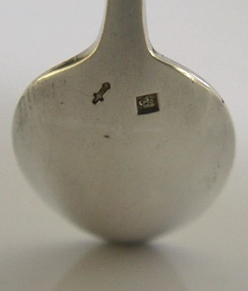 A set of six mid-century solid silver spoons featuring slim handles with reeded linear decoration and oval bowls. View VI