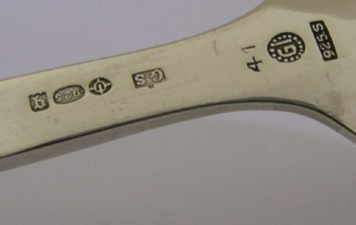 A sterling silver Georg Jensen spoon featuring a curved loop handle detailed with beaded ornamentation and a shallow oval bowl. View VIII