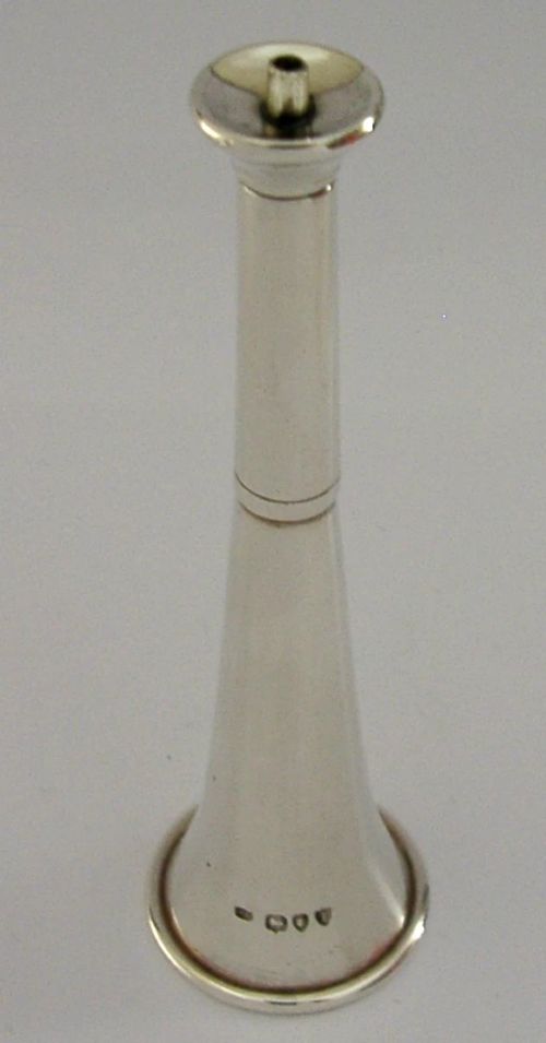 Victorian sterling silver table cigar lighter crafted in the shape of a flared fox hunting horn with British hallmarks visible near the base. View IV