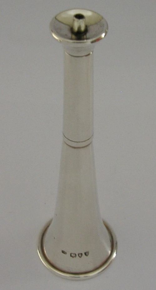 Victorian sterling silver table cigar lighter crafted in the shape of a flared fox hunting horn with British hallmarks visible near the base. View V