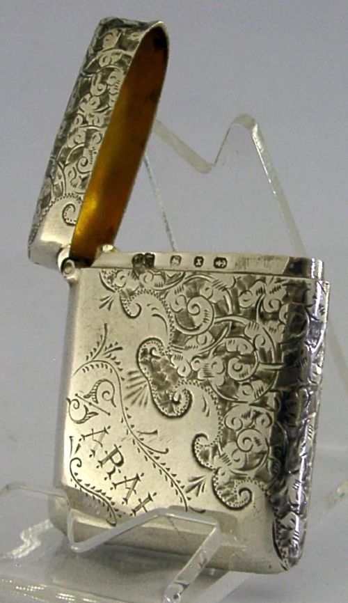 An engraved sterling silver Victorian vesta case featuring elaborate scrollwork detailing and the engraved name Sarah. View VI