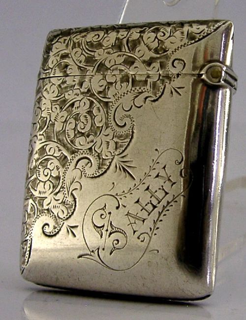 An engraved sterling silver Victorian vesta case featuring elaborate scrollwork detailing and the engraved name Sarah. View VII