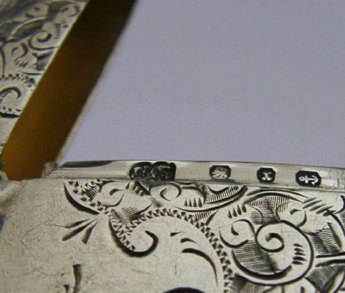 An engraved sterling silver Victorian vesta case featuring elaborate scrollwork detailing and the engraved name Sarah. View XI