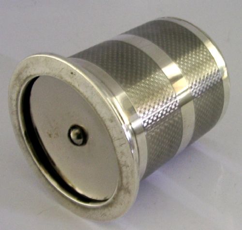 A cylindrical Art Deco sterling silver cigarette dispenser featuring engine-turned patterning, a central polished silver band, and a round knob finial on top. View VII