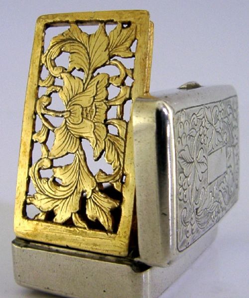 An open nineteenth-century rectangular Chinese export silver vinaigrette box showing a gilded interior with an intricately pierced floral grille. View III