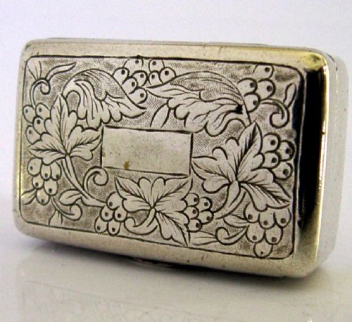 An open nineteenth-century rectangular Chinese export silver vinaigrette box showing a gilded interior with an intricately pierced floral grille. View IV