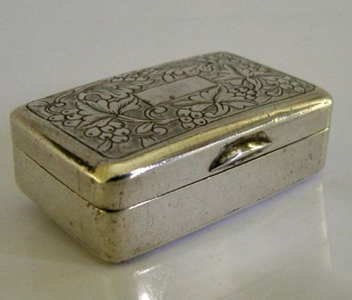 An open nineteenth-century rectangular Chinese export silver vinaigrette box showing a gilded interior with an intricately pierced floral grille. View VIII