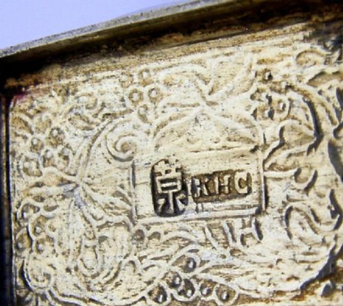 An open nineteenth-century rectangular Chinese export silver vinaigrette box showing a gilded interior with an intricately pierced floral grille. View XI