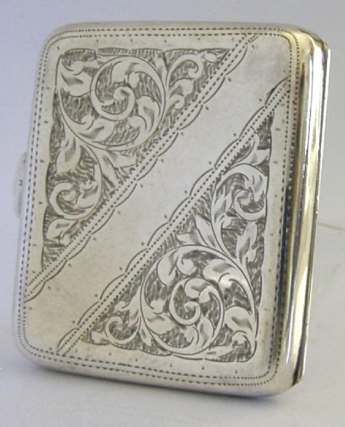 An engraved Edwardian sterling silver cigarette case featuring floral foliage and presentation text for the Independent Order of Oddfellows dated November 1910. View VI
