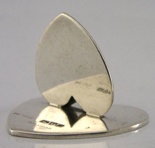 An Edwardian sterling silver menu holder featuring an upright heart clip on a double-heart flat base. View II