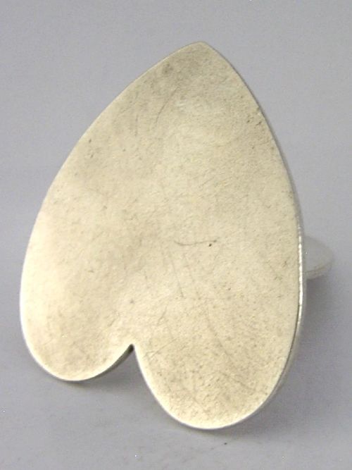 An Edwardian sterling silver menu holder featuring an upright heart clip on a double-heart flat base. View III