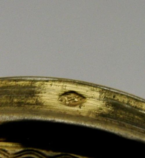 A circular French sterling silver gilt trinket box featuring engine-turned guilloche detailing and a decorative laurel leaf border. View VI