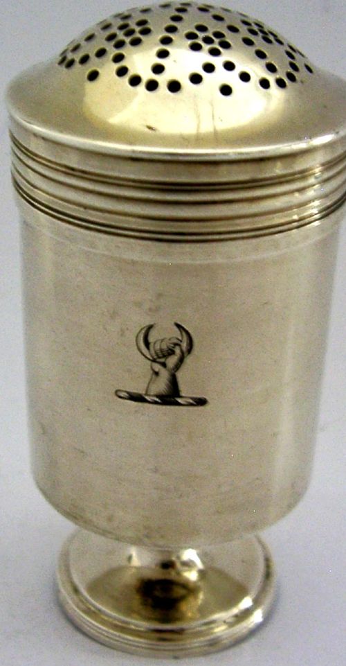 A Georgian sterling silver cylindrical caster top showing a hand-pierced dome with a gilded interior. View II